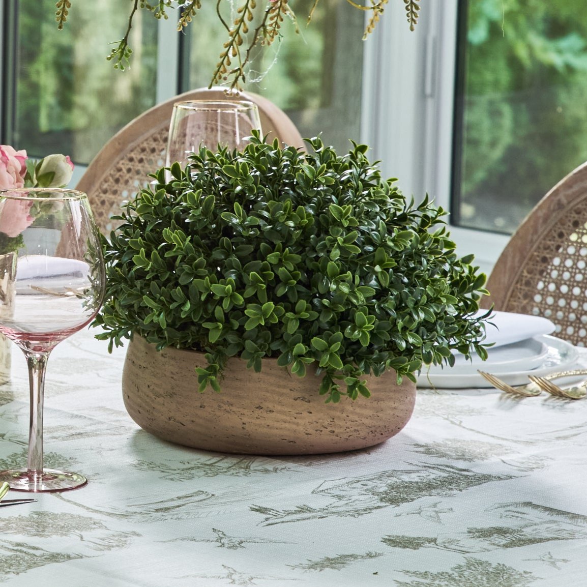 Flaura faux green boxwood in stone planter