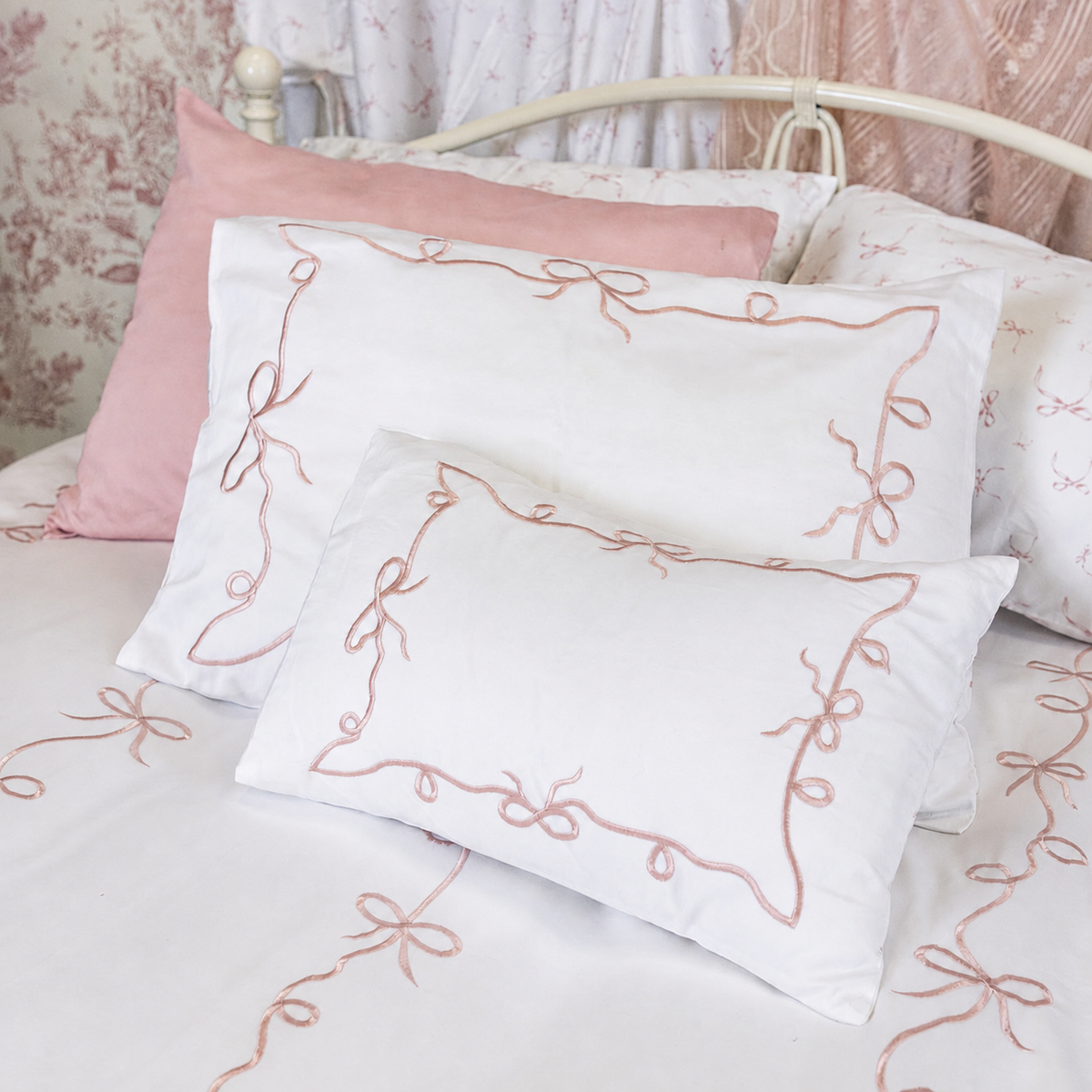 Pink bow embroidery detail